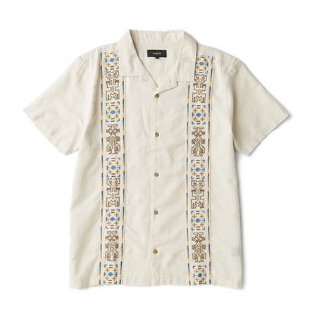 Close-up view of a rugged outdoor shirt featuring detailed stitching on the sleeve, sturdy collar, and secure buttons, perfect for adventure and travel.